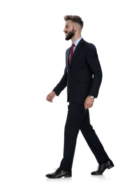 istock side view of happy businessman walking 1239716404