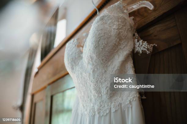 Photo Of A Wedding Dress Hanged On A Closet Stock Photo - Download Image Now - Wedding Dress, Closet, Art
