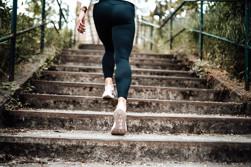 a sport girl going up on stairs