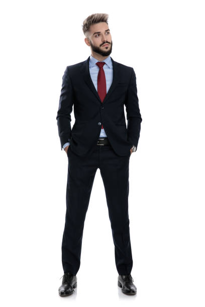 istock proud businessman looking to side and holding hands in pockets 1239721950