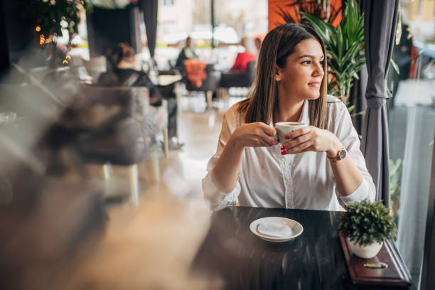 istock Woman in the coffee shop 1239739455