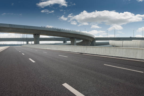 istock Clear blue sky and white clouds in the background, highway overpass curved approach bridge 1239741065