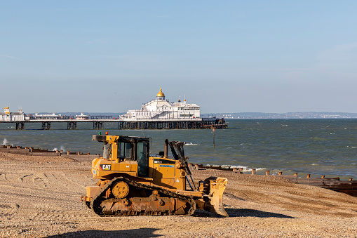 Eastbourne, United Kingdom - May, 29, 2020: Bulzoder works on the Eastbourne beach., East Sussex, United Kingdom