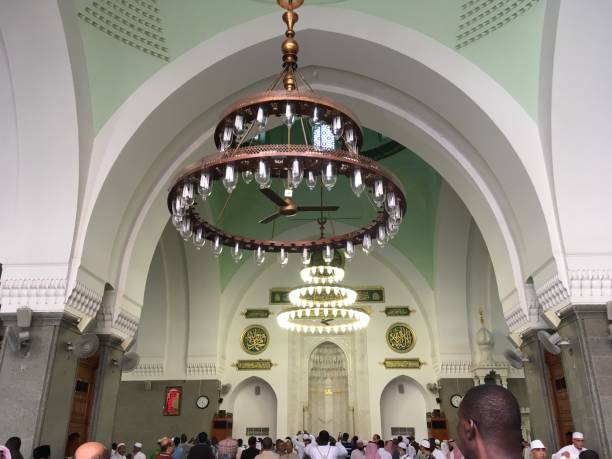 People and the interior of Quba Mosque in Medina, Saudi Arabia