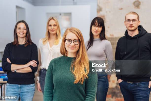 Young Redhead Woman With Her Business Team Stock Photo - Download Image Now - Founder, Business, Teamwork