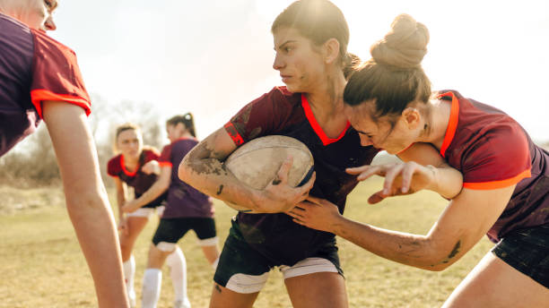 istock Female rugby players in action 1239766146