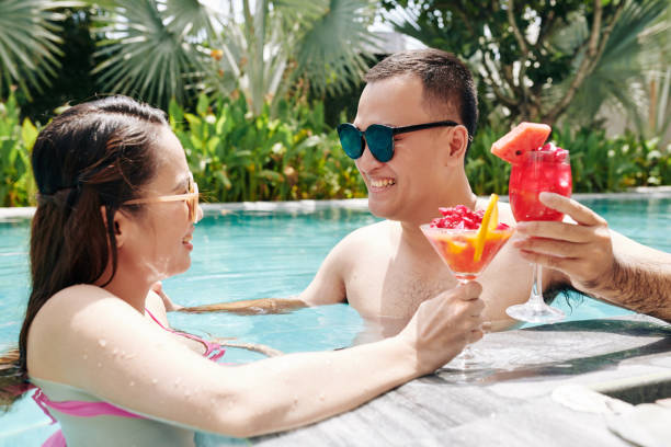 istock Couple eating smoothie in swimming pool 1239769495