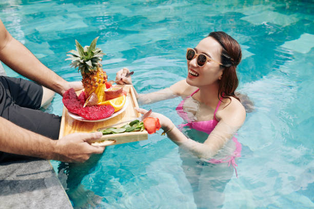 istock Breakfast in swimming pool 1239769514