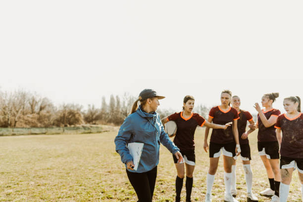 istock Female rugby team and their coach 1239769515