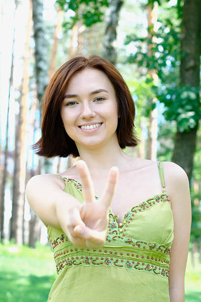 istock Girl with two fingers up 123977839