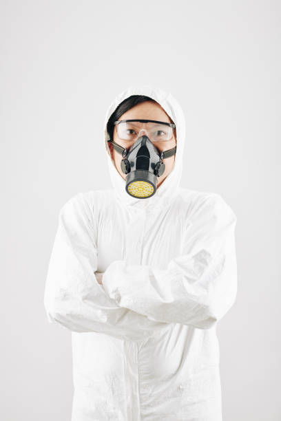 istock Man in protective clothing and gas mask 1239786039
