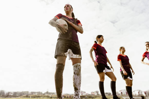 istock Determined rugby player and her team on the rugby field 1239788210