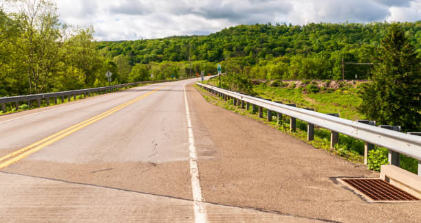 istock A highway through the woods in Warren County, Pennsylvania 1239788729