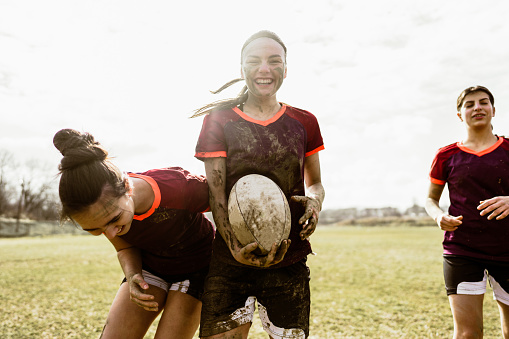 Photo of female rugby players on the rugby field