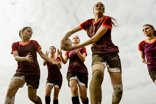 Photo of a female rugby team during the match