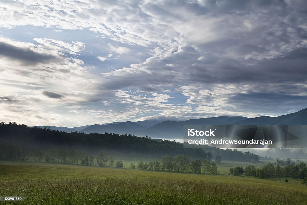 Dramatic skies in the Smokies Dramatic clouds overlook the Cades Cove area of the Great Smoky Mountain National Park. Agricultural Field Stock Photo