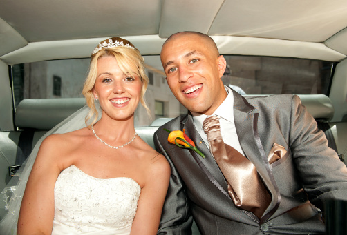 Close up of the Bride and Groom in the wedding car