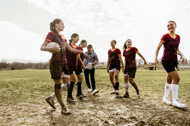 istock Female rugby team and their coach 1239820773