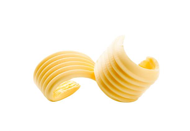 istock Closeup of two butter curls on white 123982685