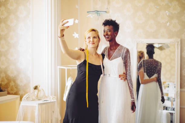 istock Fashion designer is taking a selfie with her happy client 1239833079
