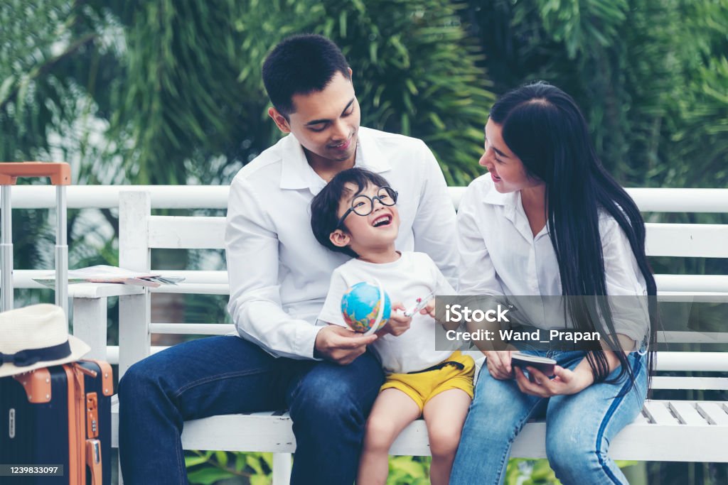 Happy family planning travel in summer vacation. Asia young people lifestyle packing bag luggage and enjoy fun and relax leisure destination in holiday. Travel and Family Concept Hotel Stock Photo