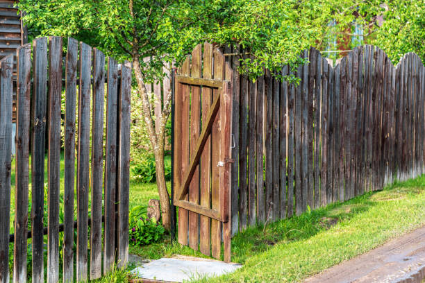 istock Open gate in a wooden fence 1239835811