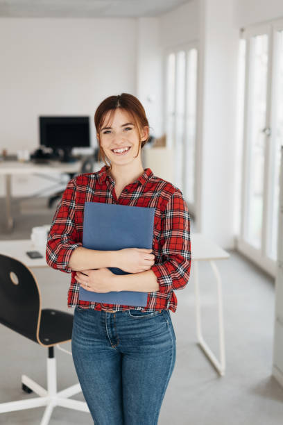 istock Friendly hopeful job applicant clutching a CV 1239841885
