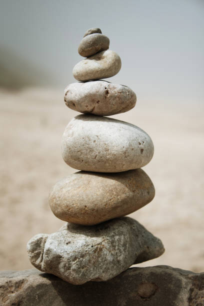 istock Stacked stones at the beach 1239842833