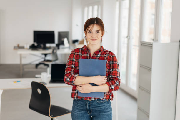 istock Attractive young job applicant in jeans with CV 1239843943