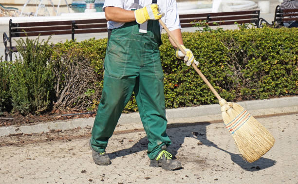 istock Street cleaner works with a broom 1239847692