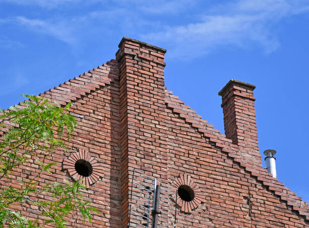 istock Wall of an old brick house with smoke stacks 1239848794