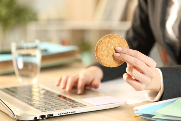 istock Entrepreneur hands holding cookie working on laptop 1239849366