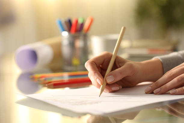 istock Designer woman sketching drawing with pencil on desk 1239849879