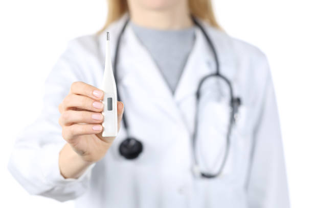 istock Doctor hands showing thermometer isolated on white 1239849890