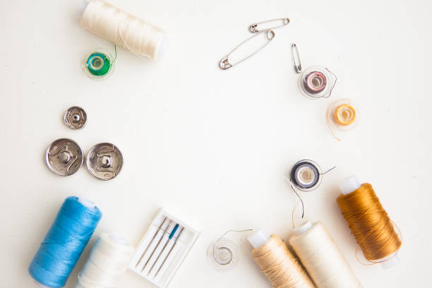 istock Sewing tools on the white background with copy space in center 1239882025