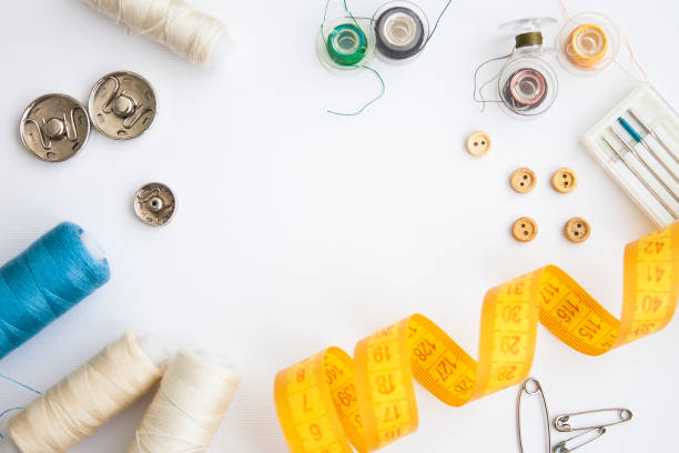 istock Sewing tools on the white background with copy space in center 1239882089