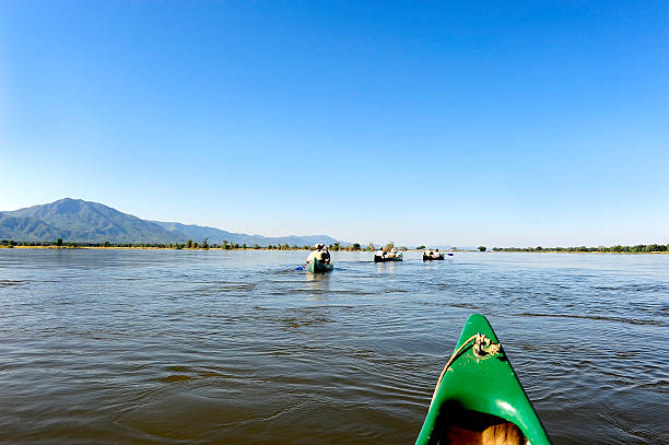 Canoe trip down the Zambezi River at the high water mark, as it traverses between Zimbabwe and Zambia.
