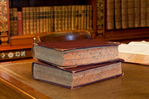 Old books in classic library stock photo