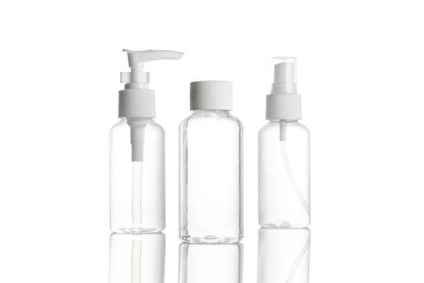 istock Spray bottle, empty pump clear plastic container cosmetic soap and mineral shampoo. Antiseptic gel isolated in water blank cap on white background. Antibacterial sanitizer tube 1239885458
