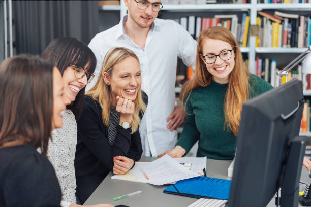 istock Successful business team smiling in satisfaction 1239888726