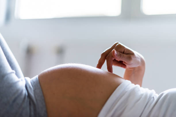 istock Pregnant woman's belly 1239908348