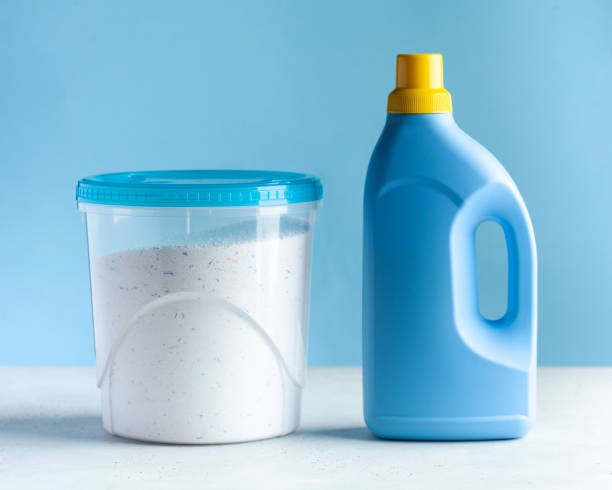 Laundry detergent, washing powder, Laundry gel. Concept of General cleaning, Laundry, household chemicals. Copy space Laundry detergent, washing powder, Laundry gel on a blue background. Concept of General cleaning, Laundry, household chemicals. laundry detergent stock pictures, royalty-free photos & images