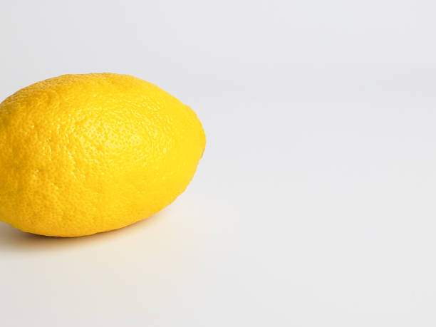 istock One ripe juicy yellow lemon on white background 1239911058
