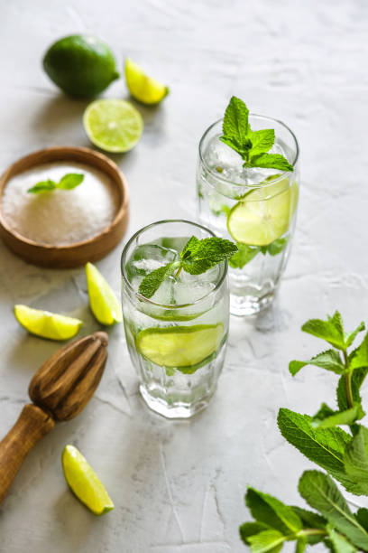 istock Two glasses of mojito. Making Mojito Cocktail At Home. 1239912087