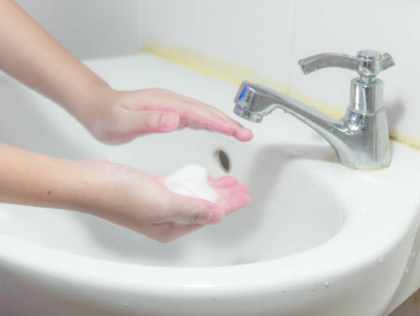 istock Washing of hands with soap 1239912600