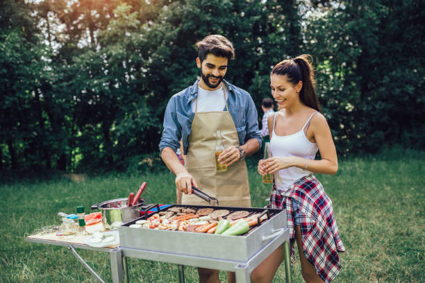 istock Friends having a barbecue party in nature 1239920622