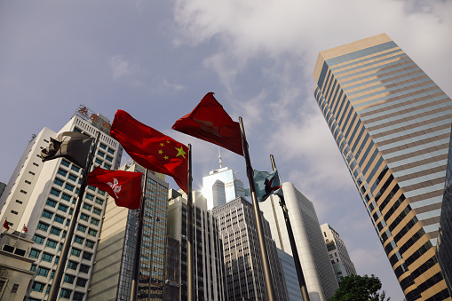 Waving Chinese flag isolated over white background