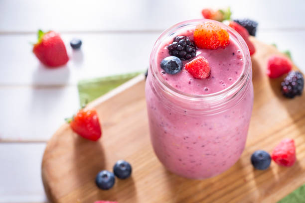 Berry Smoothie Homemade Berry Smoothie with Strawberry, Blackberry, Raspberry and Blueberry smoothie photos stock pictures, royalty-free photos & images