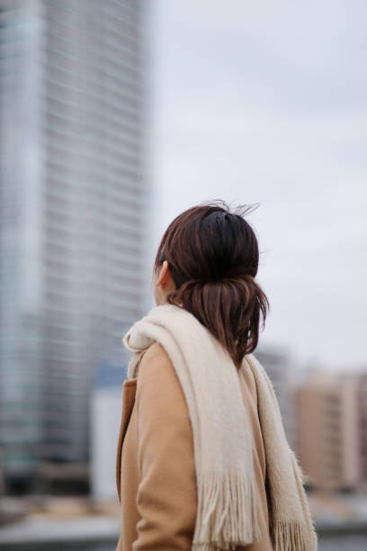 istock Businesswoman looking at building 1239924463