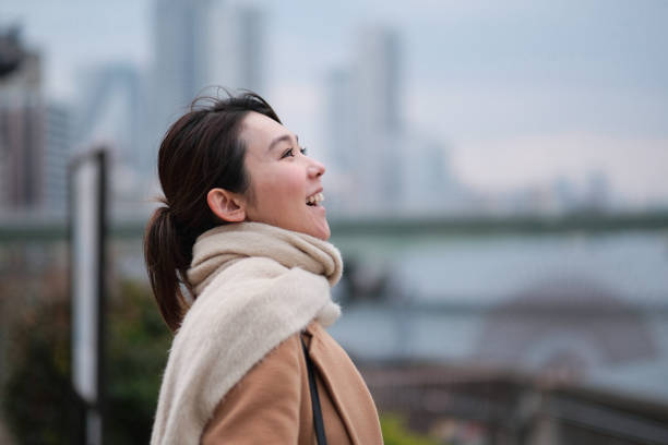 istock Businesswoman smiling in city 1239928126